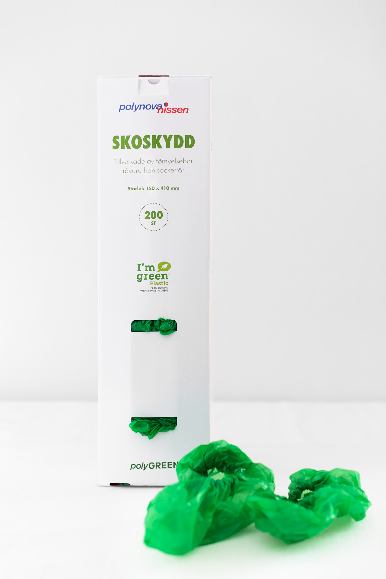 gröna Skoskydds dispenser